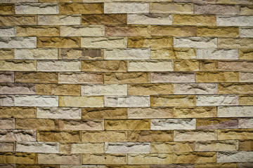 San stone brick wall.