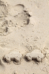 Car figure in sand