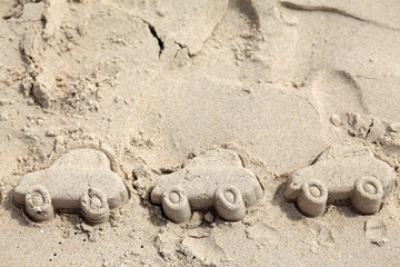 Car figures made in sand