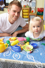 Man with children playing together