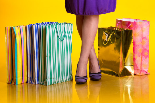 Female legs and shopping bags