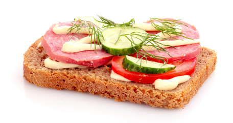 tomatoes and sausage on bread isolated on white