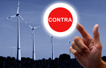 Hand klickt einen Schalter an - Contra Windkraft