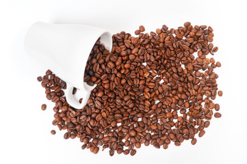 Coffe beans with a mug on white background