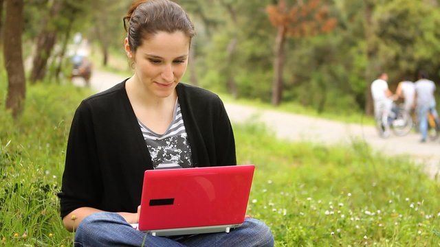 beautiful girl using computer, phaeton passing behind