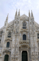 Fototapeta na wymiar The Gothic facade of the Cathedral in Milan Italy