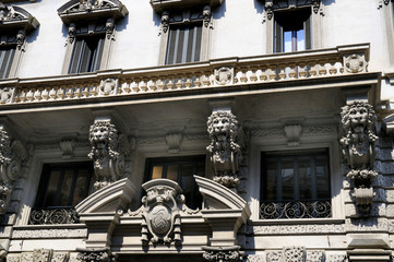 Ornate facade of building in Milan Italy