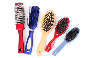 Different types of hairbrushes isolated on white