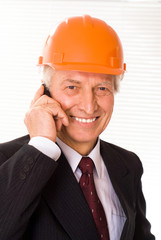 old builder in the helmet