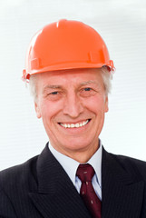 old builder in the helmet