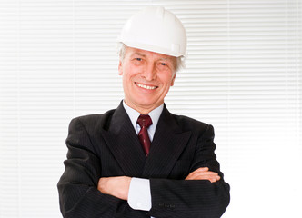 old builder in the helmet