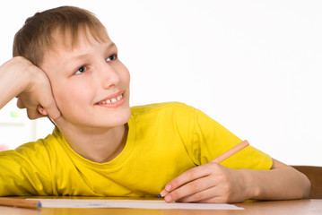 young boy at the table