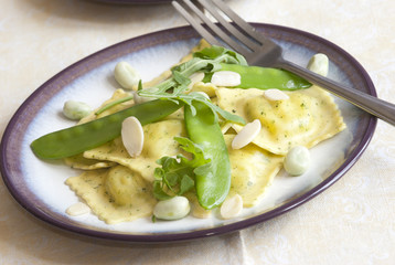 Ravioli with snap peas and almonds