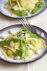 Ravioli with snap peas and almonds