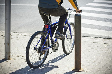 Undefined  bike rider crossing street. - 32720688