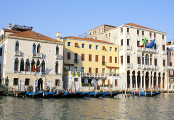 Fototapeta na wymiar Several gondolas on grand canal in Venice in Italy