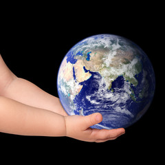 Little girl hold globe on black