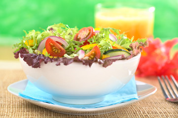 Fresh mixed salad with orange juice