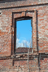 A window in the brick building ruins