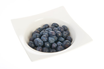 White bowl with blueberries