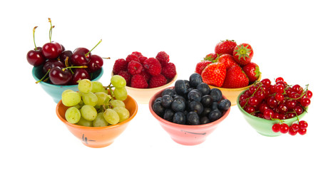 Colorful bowls fresh summer fruit