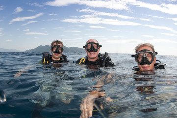 scuba divers on surface