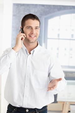 Happy young man on phone