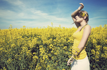 Young woman relaxing on a green meadow