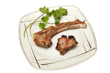 lamb chops kebab against white background