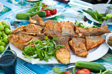 Deep fried whole fish on a table