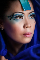 Young Pretty Asian Woman in a Blue Veil with Makeup