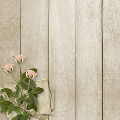 Old wooden background with frame and bunch of flower