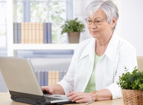 Old lady using laptop