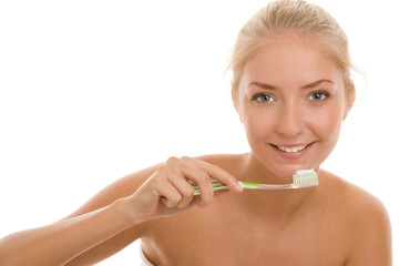 Woman brushing teeth