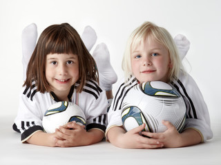 Two little girls as football fans like the  Woman´s World Cup