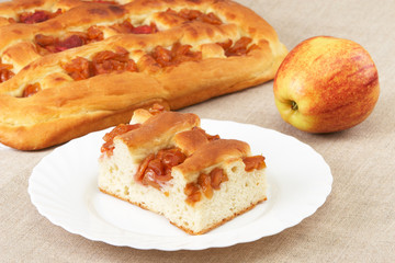 Homemade pie with apples and an apple