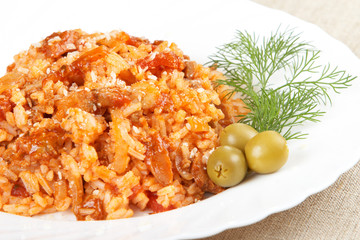 Risotto with meat, mushrooms and tomato sauce