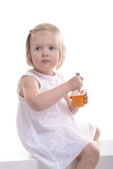 little girl eating yoghurt