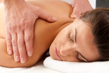 Obraz na płótnie Canvas Woman receiving massage relax treatment close-up portrait