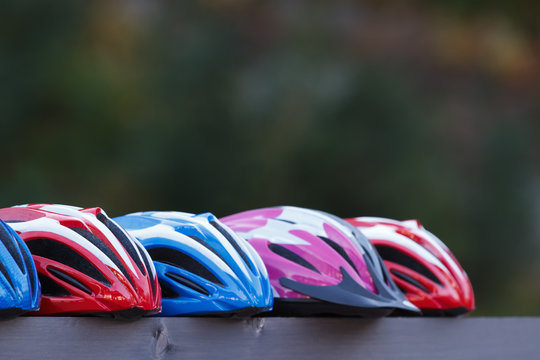 Five Colorful Bicycle Helmets Outdoors