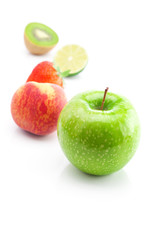 big juicy red ripe strawberries,apple,lime,peach and kiwi  isola