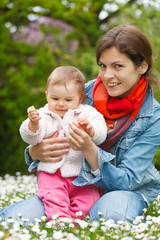 Mother with baby playing in the park