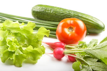 Vegetables and herbs on a white background