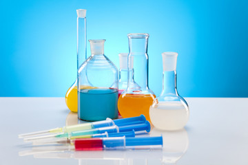 Laboratory flasks with fluids of different colors