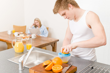 Breakfast happy couple make orange juice morning