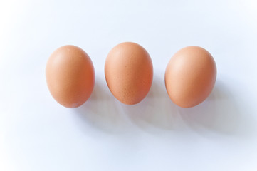 close up three hens eggs