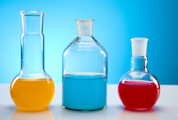 Laboratory flasks with fluids of different colors