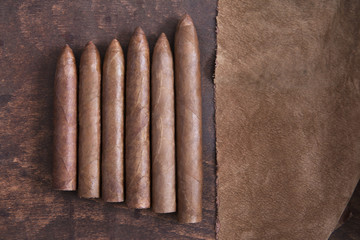Cigars and brown cloth on the table