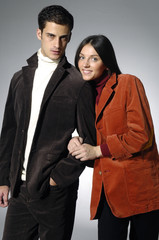 . Young woman embraces man. woman in a red dress