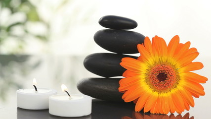 Black stones, candles and sunflower - Powered by Adobe